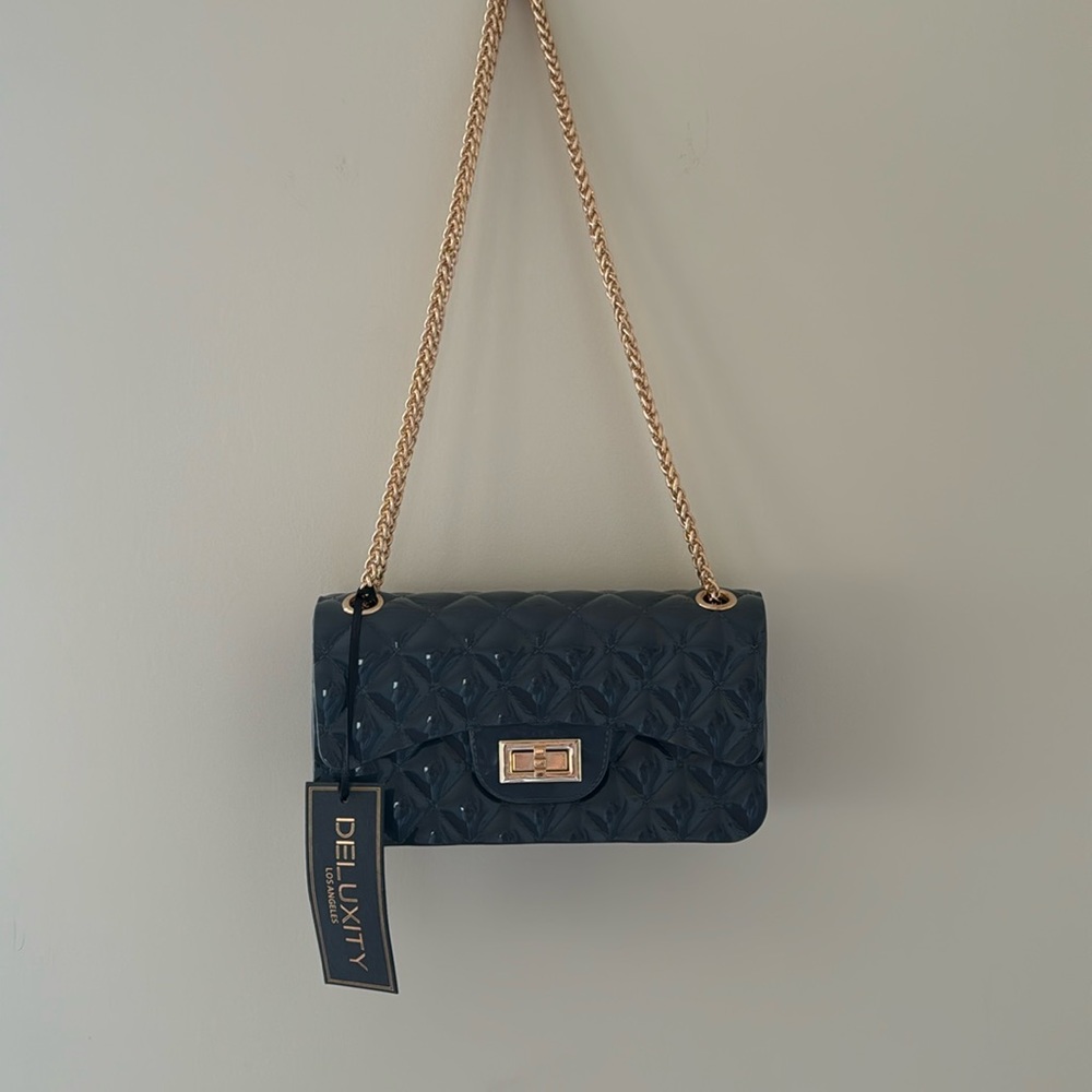 gray shoulder/cross body bag on gold chain